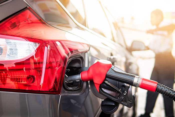 Car refueling at gas tank