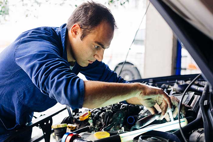 Mechanic working on car