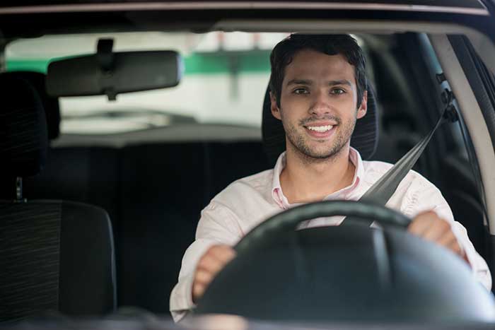 Happy man driving his car
